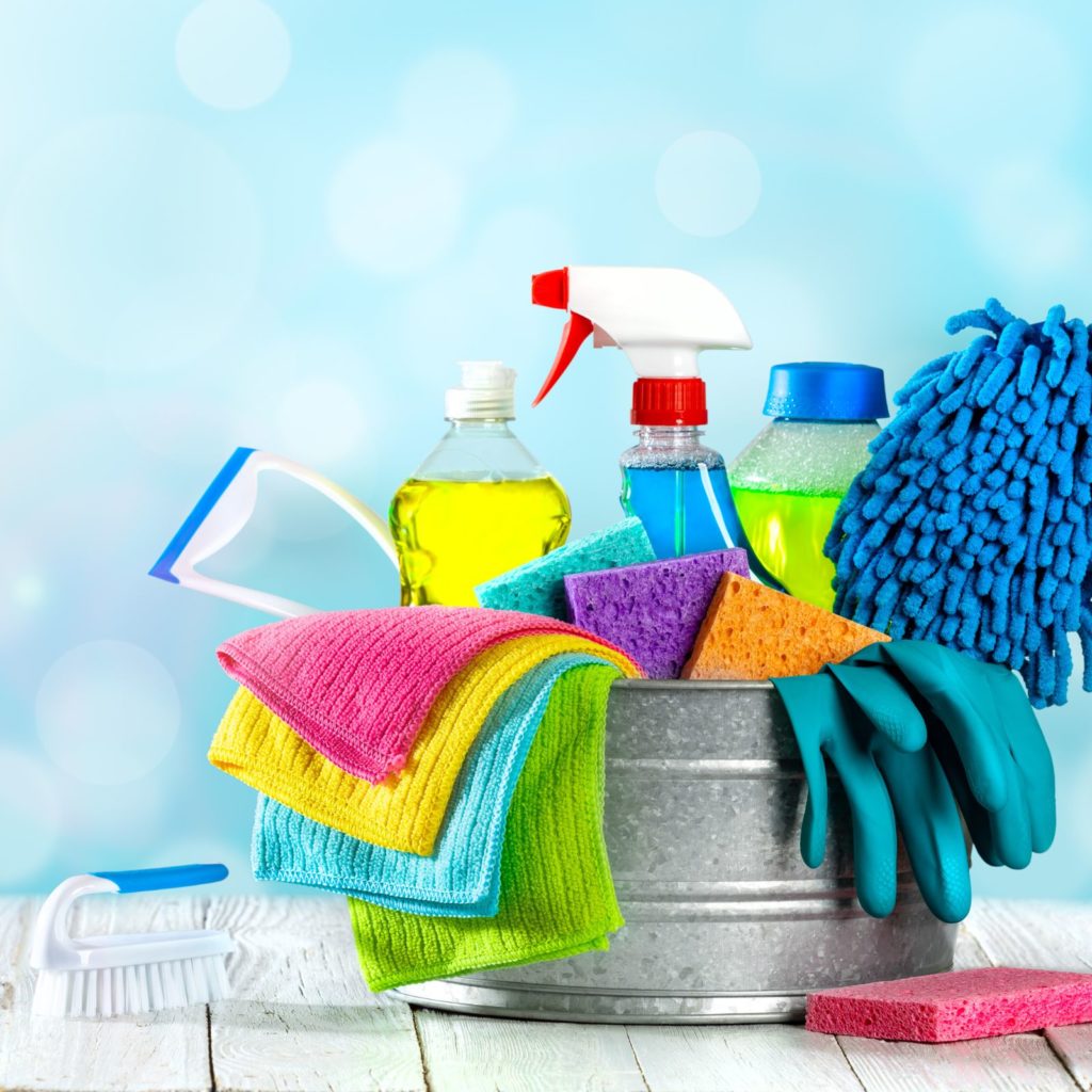 Bucket full of cleaning supplies - cover image for apartment cleaning checklist post